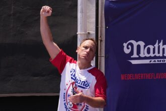 Joey Chestnut reclaims Hot Dog Eating Contest title after last year’s absence by downing 70.5 franks