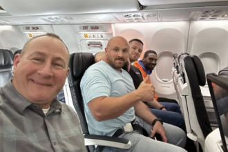 Smiling fugitive recaptured and returned to Kentucky after dramatic airport escape