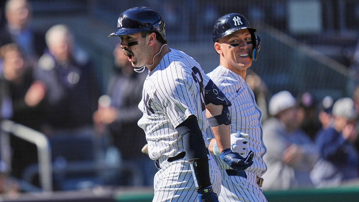 Austin Wells celebrates with Aaron Judge