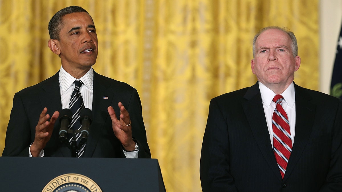 Barack Obama speaking with John Brennan
