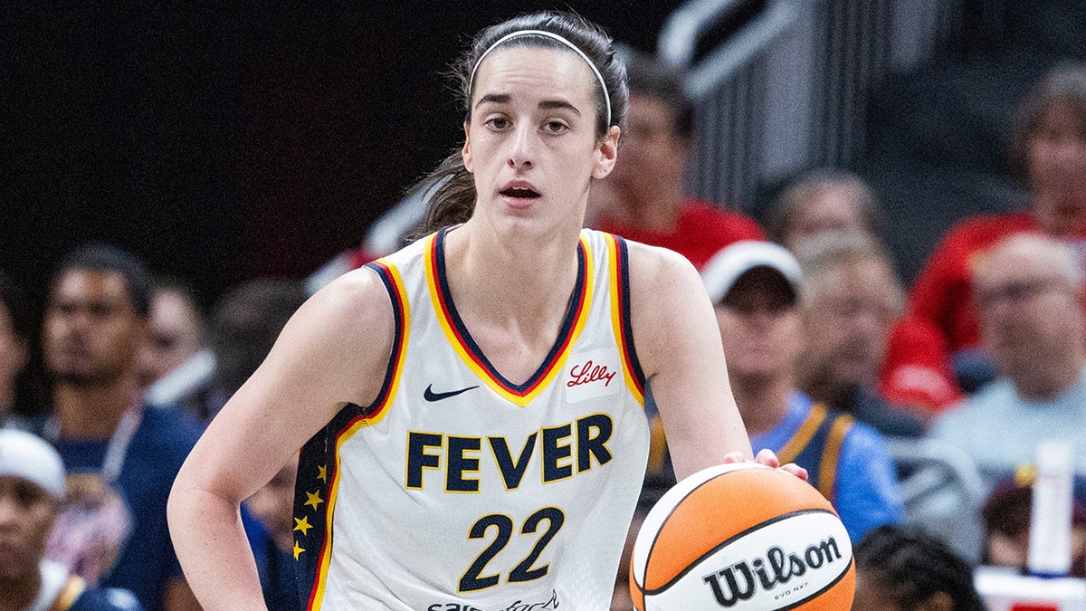 Caitlin Clark dribbles