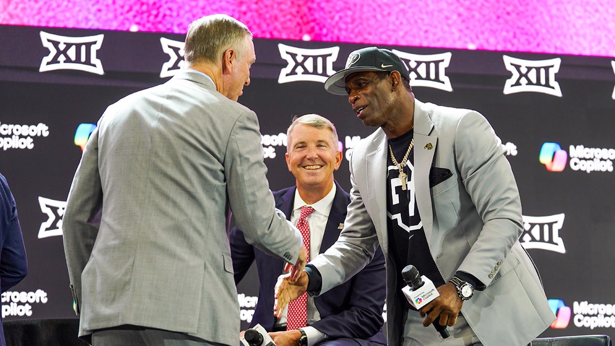 Deion Sanders shakes Willie Fritz's hand