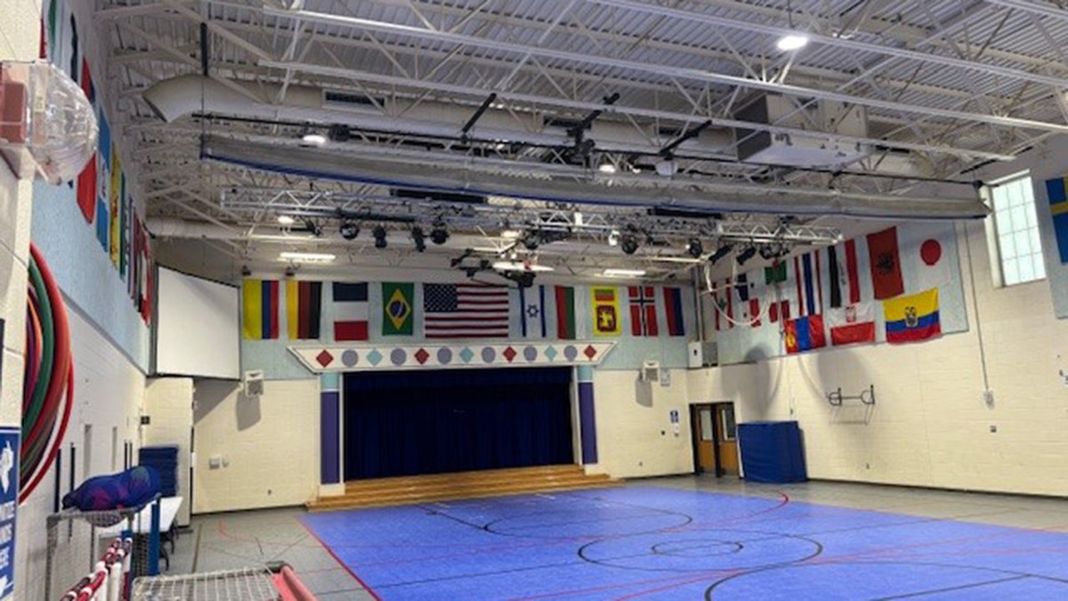 Nysmith School gym with Israeli, Palestinian and American flags