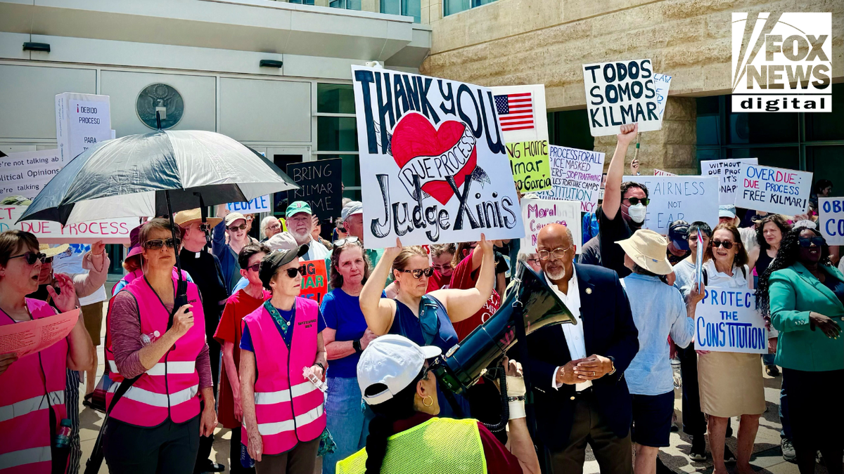 Demonstrators gather outside the U.S. District Court in Greenbelt, Md., to protest the continued detention of Kilmar Abrego Garcia, a migrant and alleged MS-13 member who was deported to El Salvador in March, in what Trump administration officials have acknowledged was an "administrative" error.