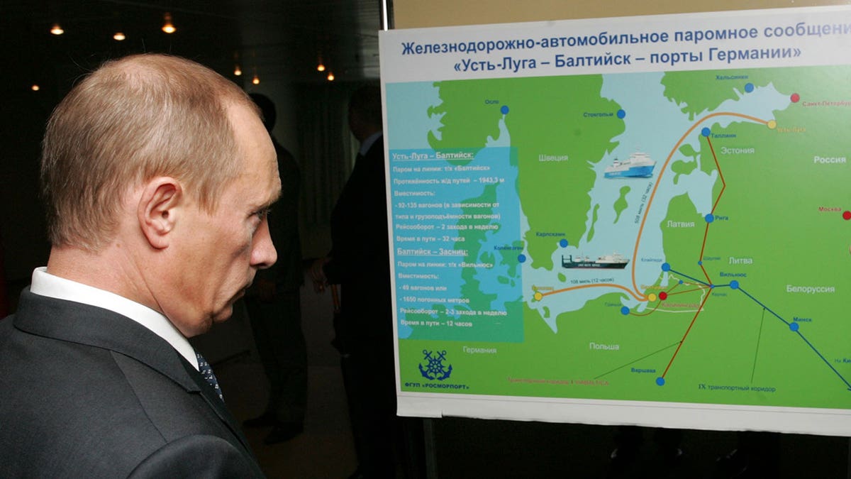Putin looks at map of Kaliningrad.