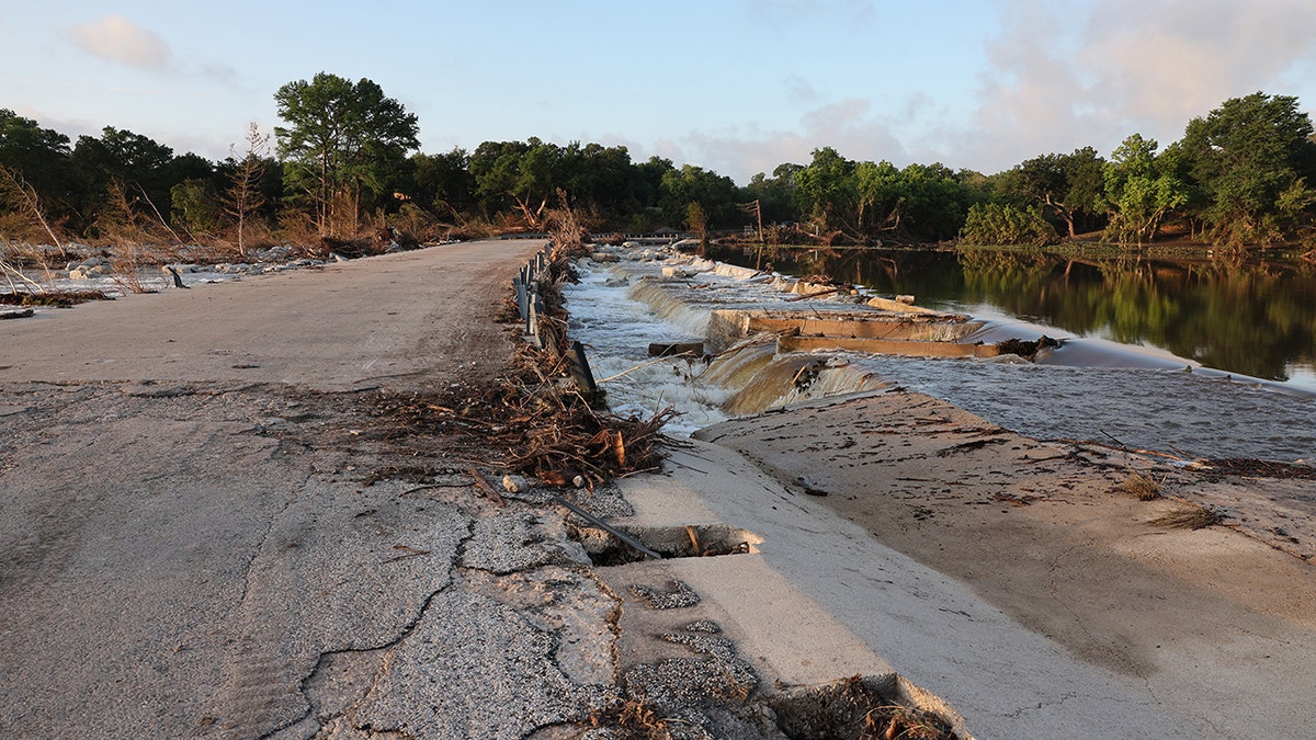 Road cracked and destroyed from flood damage in Texas.
