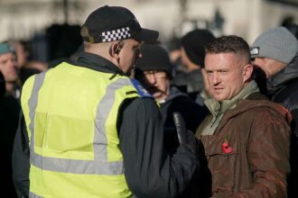 Far-right UK figure Tommy Robinson arrested over alleged assault