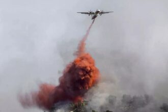 At least one person killed in massive wildfire in southern France