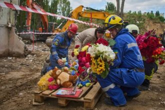 Kyiv holds official day of mourning for 31 killed in Russian strikes