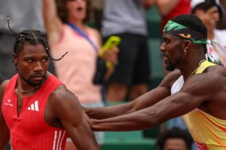 Noah Lyles stares down Olympic teammate after comeback victory, gets shoved afterward