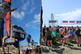 Thrill ride malfunctions at popular music festival, leaving riders stuck upside down