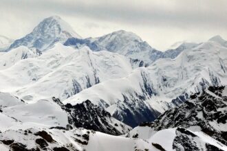 Rescue effort halted for stuck climber on treacherous mountain after climber dies trying to help her: reports
