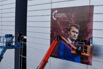 Armed man inside Charlie Kirk memorial venue charged with impersonating police officer