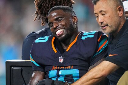 Dolphins star Tyreek Hill carted off field after gruesome knee injury, rushed to hospital