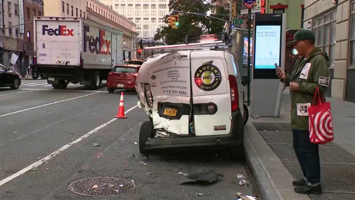 Dented white van at NYC scene