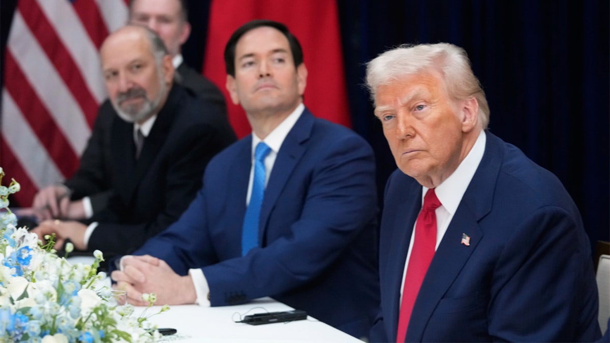 President Donald Trump, right, with Secretary of State Marco Rubio, second right, and Commerce Secretary Howard Lutnick