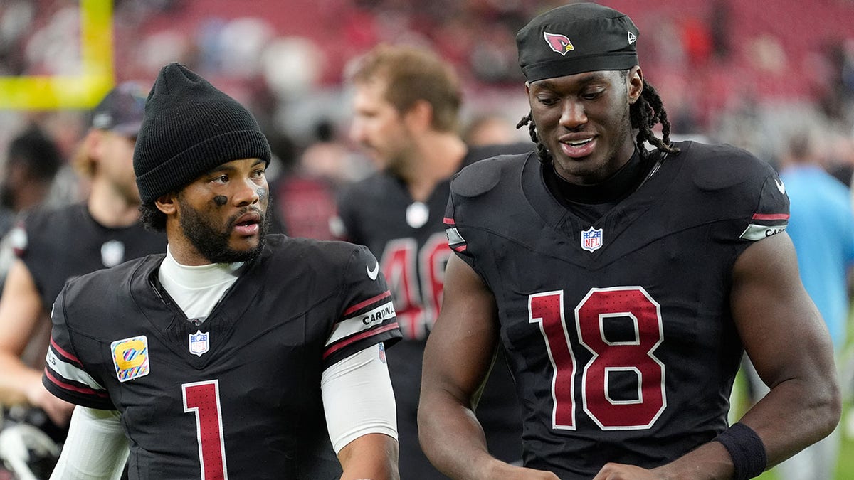 Kyler Murray walks with Marvin Harrison Jr.