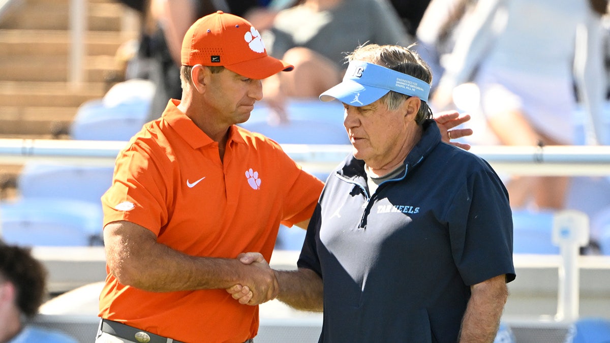 Dabo Swinney greets Bill Belichick