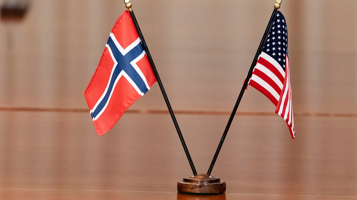 Norway and United States flags on table
