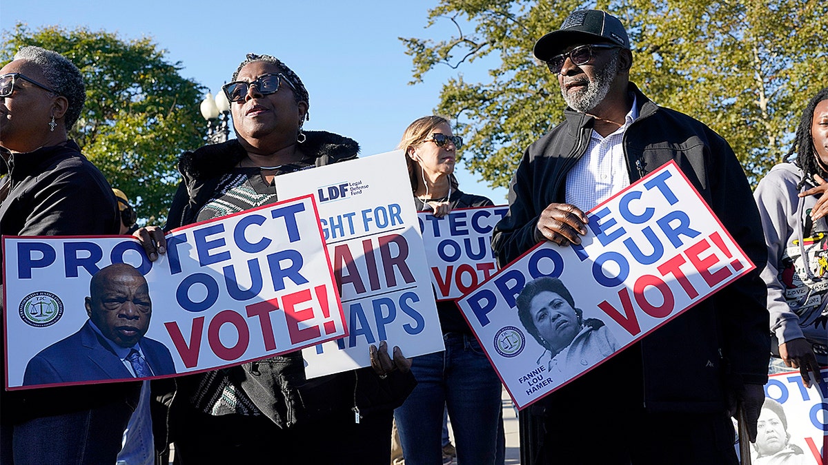 Activists demonstrate outside the U.S. Supreme Court building.