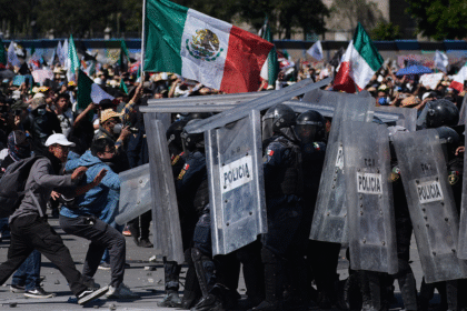 More than 100 officers injured as protesters attack police, breach barrier at Mexico’s National Palace