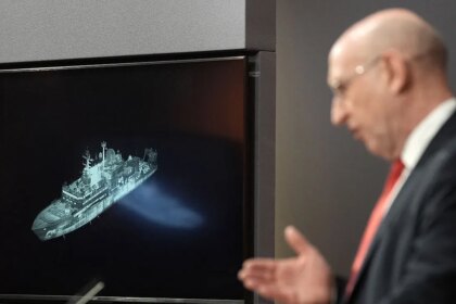 Britain says Russian spy ship is on edge of UK waters; defense secretary issues warning to Putin