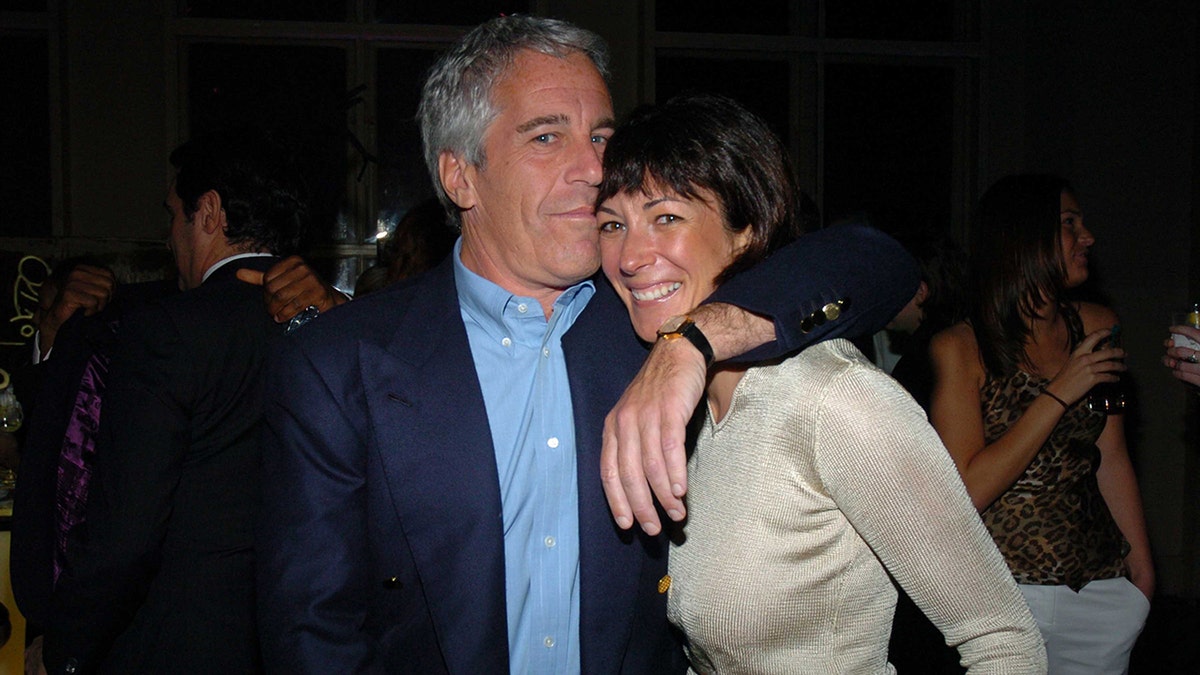 Jeffrey Epstein embracing a smiling Ghislaine Maxwell.
