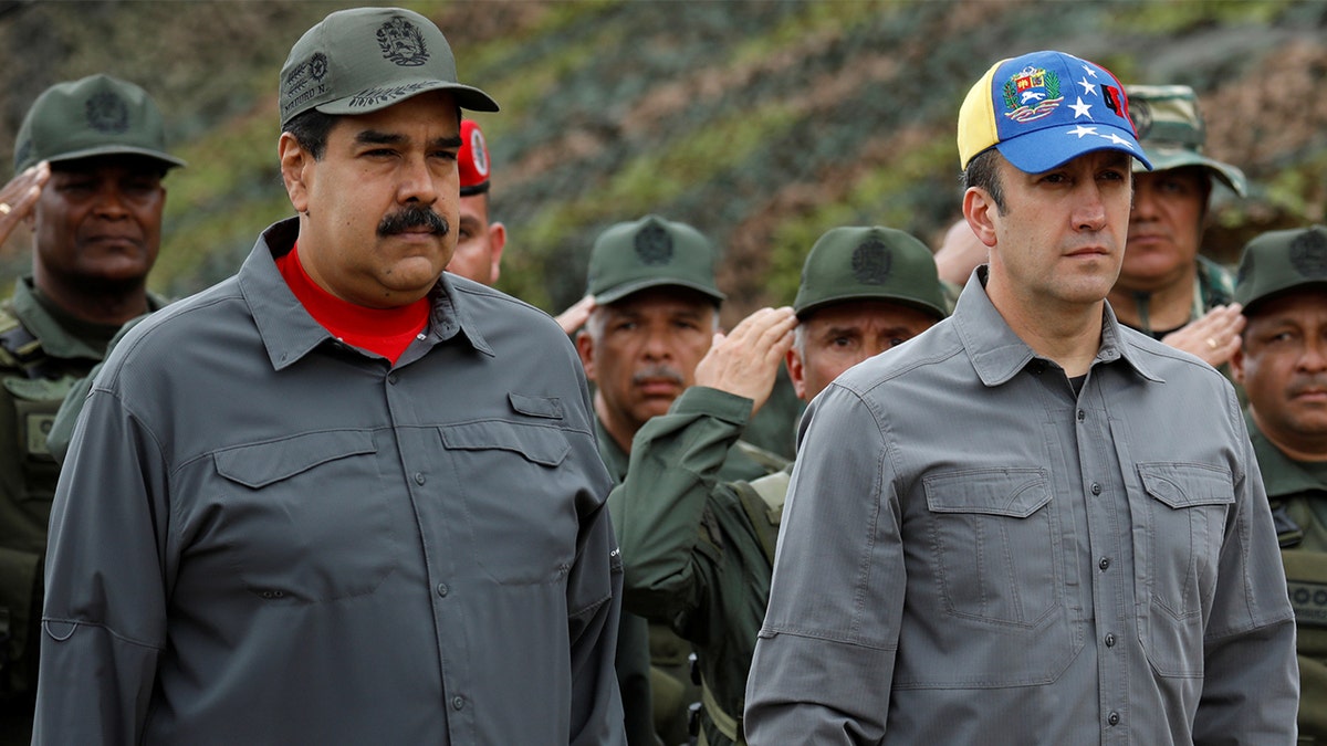 Nicolás Maduro with others at a military event.