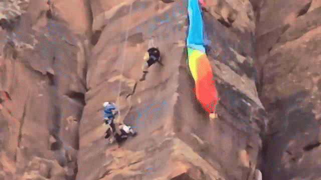 Video captures daring helicopter rescue of BASE jumper dangling from canyon wall
