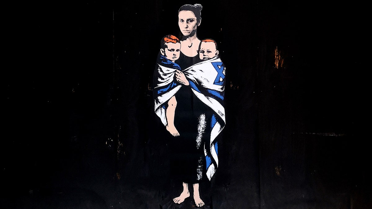 Mural of Shiri Bibas, Ariel Bibas, 4, and Kfir Bibas, 10 months