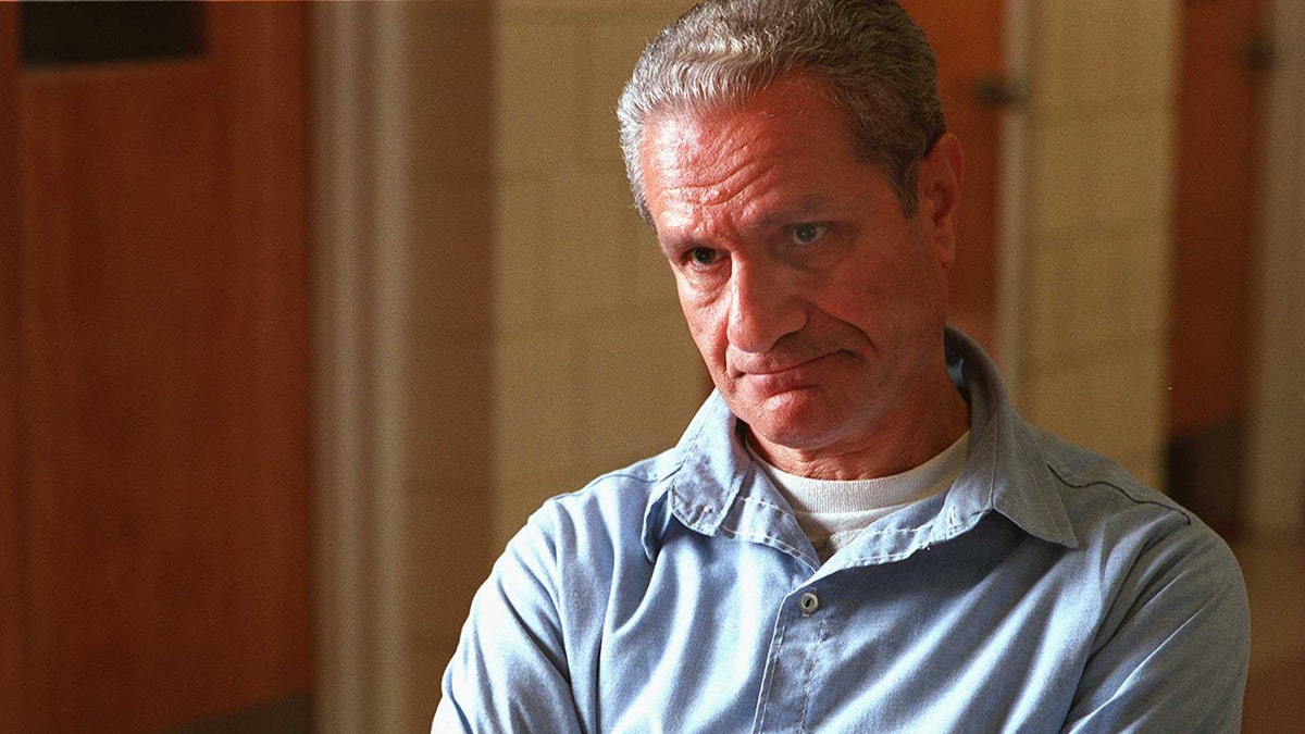 George Nassar wearing a light blue shirt.