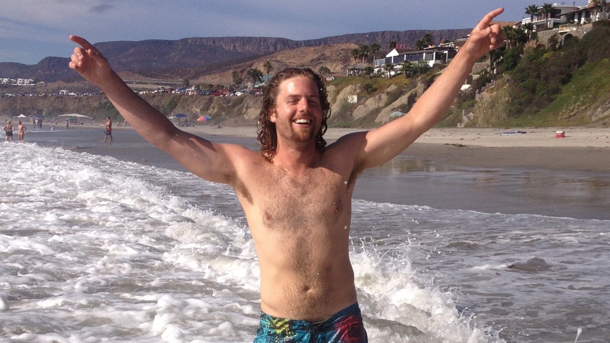 Mikey SD Fish and Sips in the water at the beach.