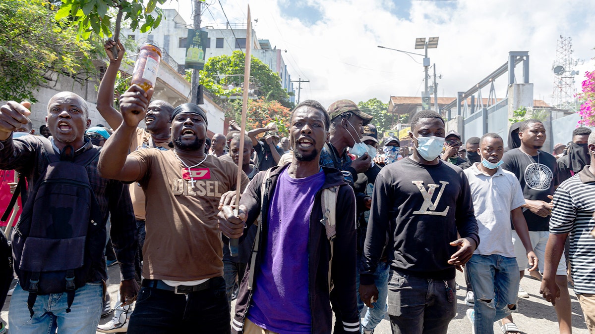 Crowds of demonstrators march through Port-au-Prince demanding government action against gang violence.