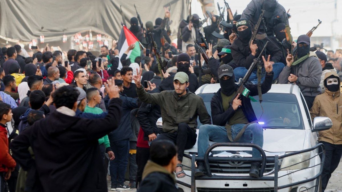 Suspected terrorists in Gaza come out of hiding as ceasefire for hostages deal gets underway in Gaza's Deir al-Balah area.