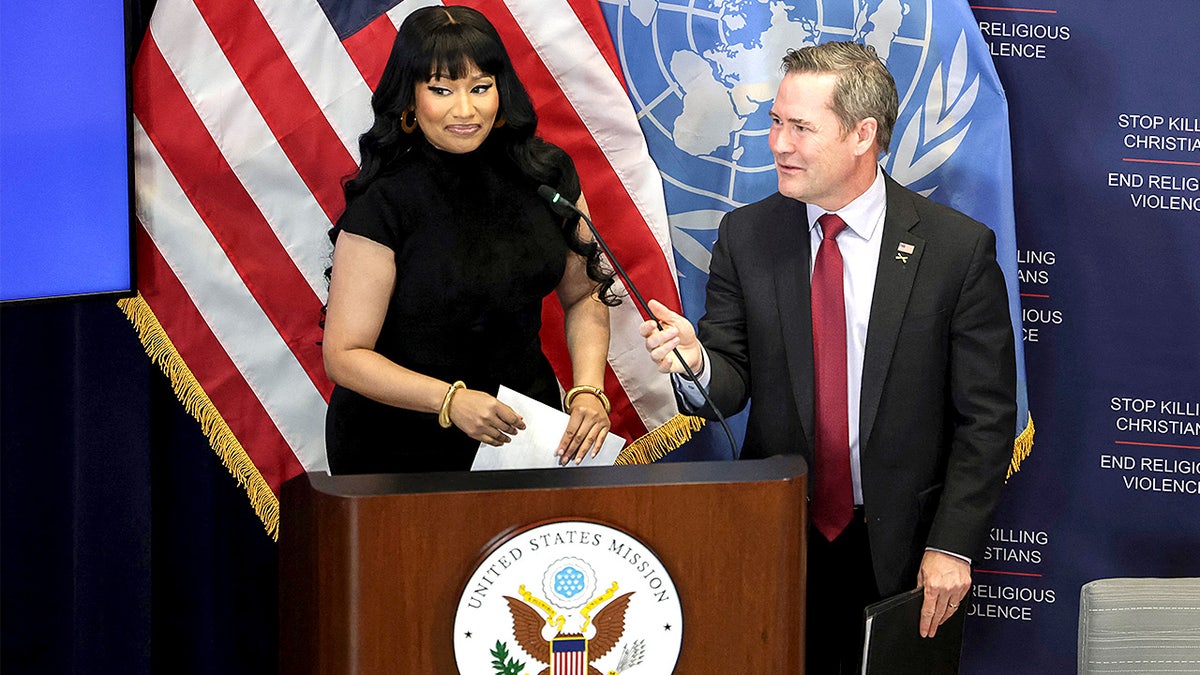 Rapper Nicki Minaj shakes hands with U.S. Ambassador to the U.N. Mike Waltz before a panel discussion at the U.S. Mission to the United Nations.
