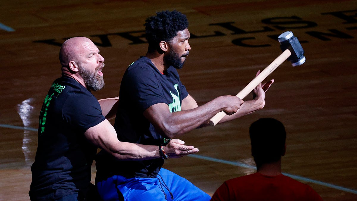 Joel Embiid with Triple H
