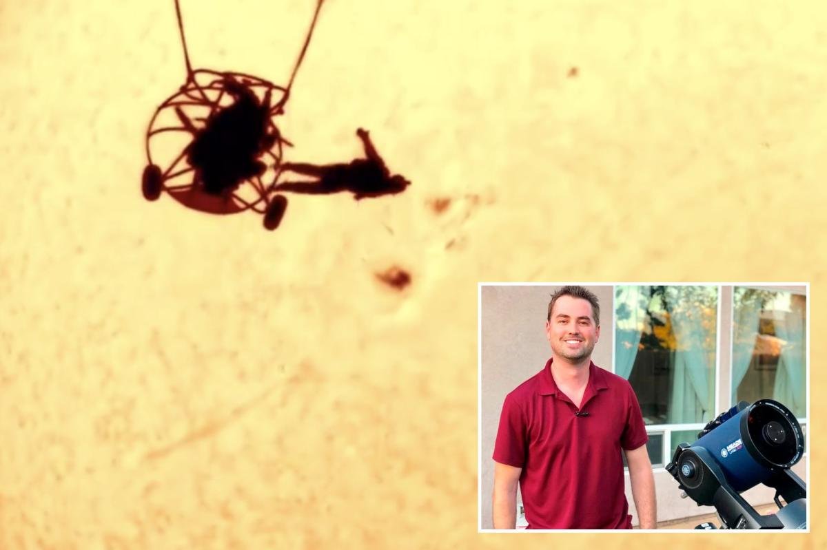 Photographer captures skydiver silhouetted against sun in stunning image