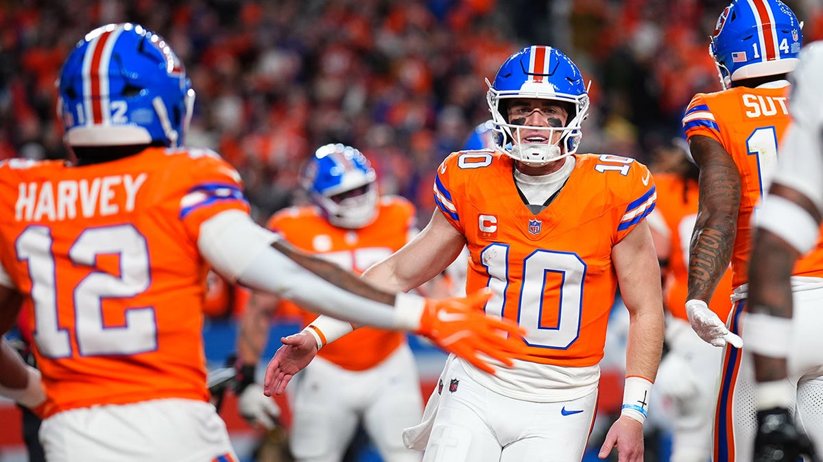 Bo Nix comes onto the field