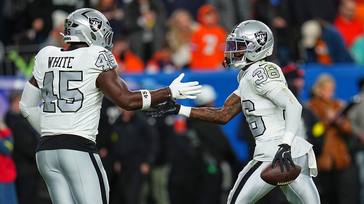 Kyu Blu Kelly celebrates an interception