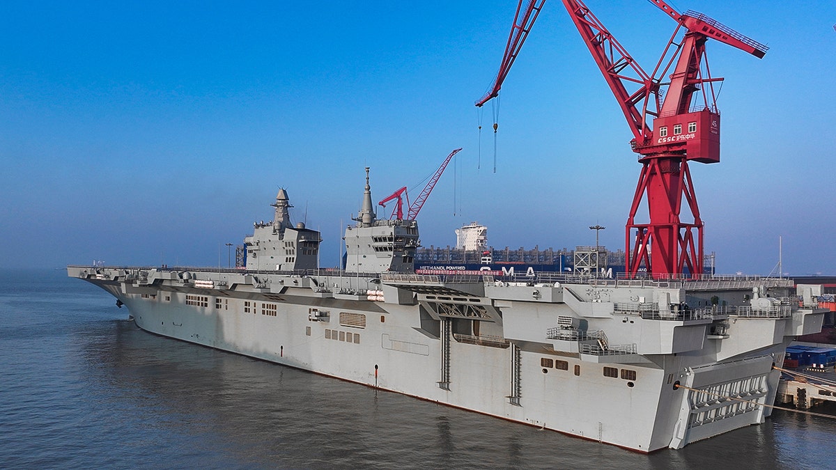 The Sichuan docked at a port.