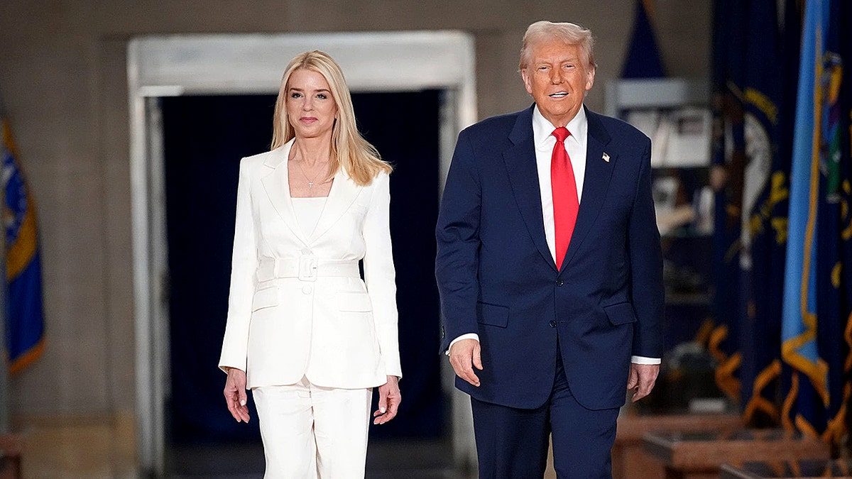 Donald Trump walking with Pam Bondi