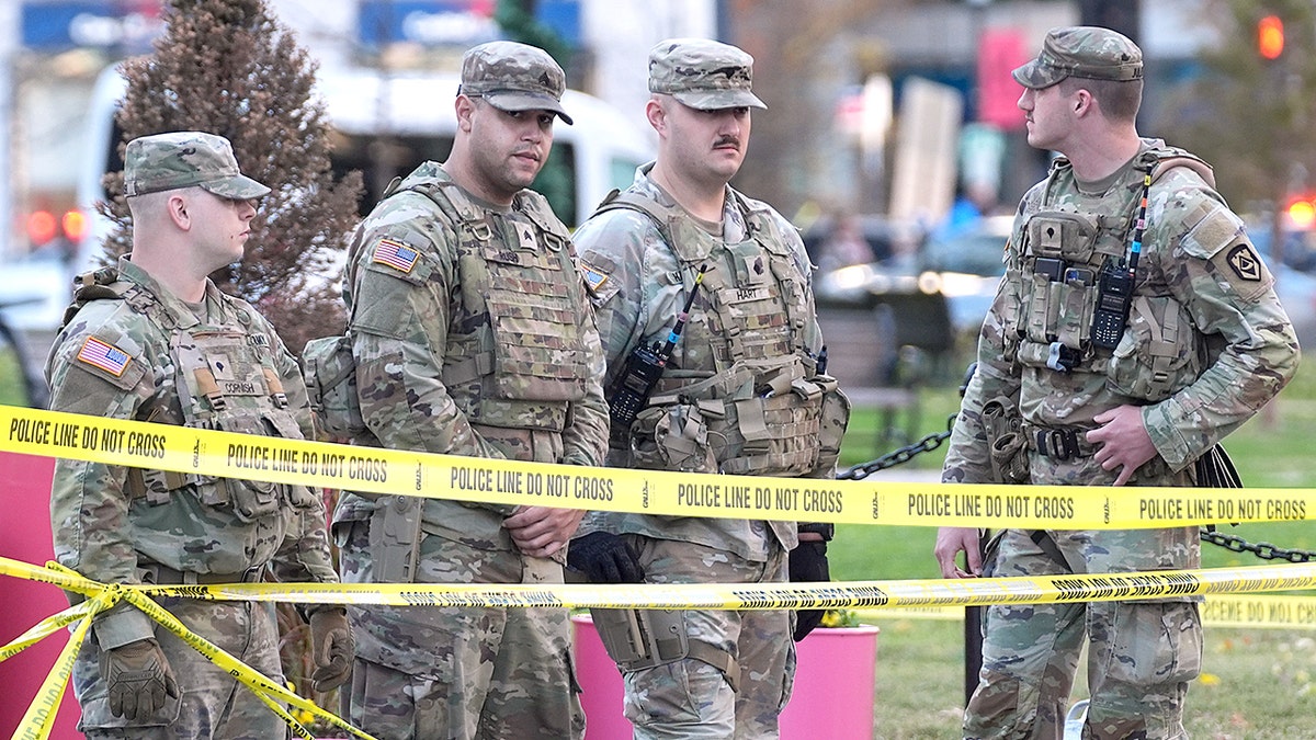 National Guard soldiers stand together after shooting in DC
