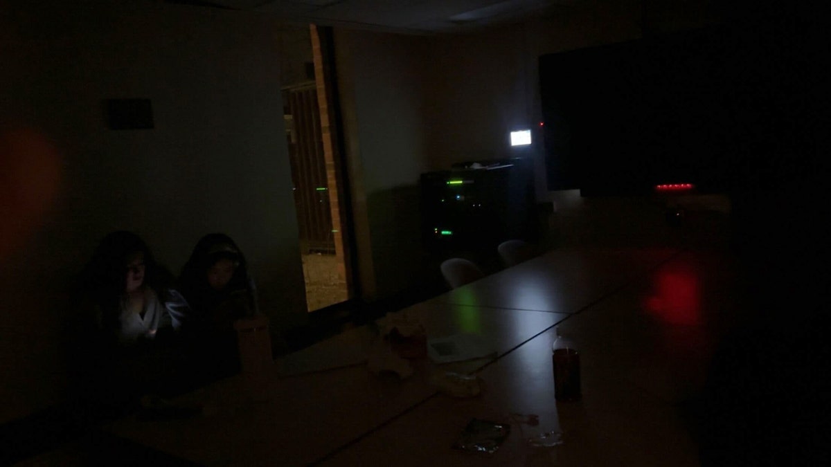 Students hide in a room during campus lockdown