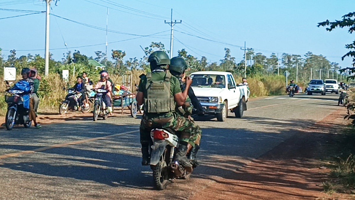 cambodian soldiers evacuate residents from village