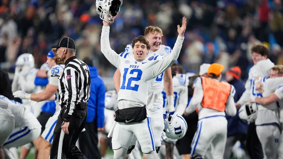 Duke's Dan Mahan (12) celebrates defeating the Virginia Cavaliers during the 2025 ACC Championship game at Bank of America Stadium.