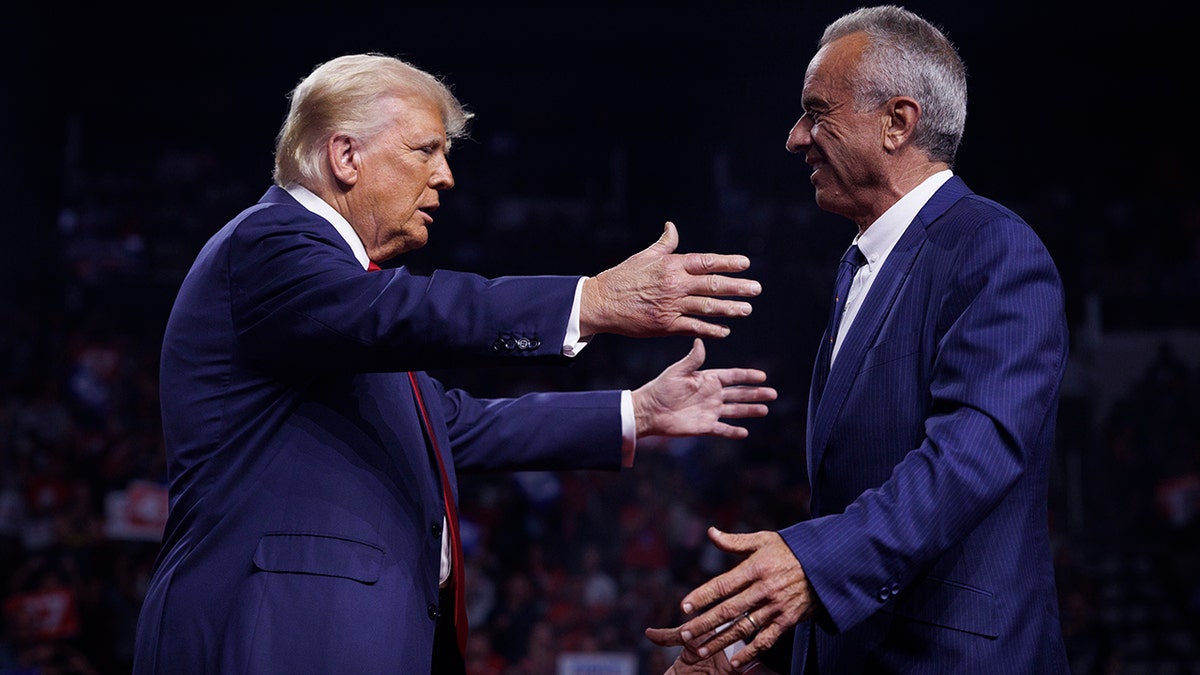 trump leans in for a hug with rfk jr