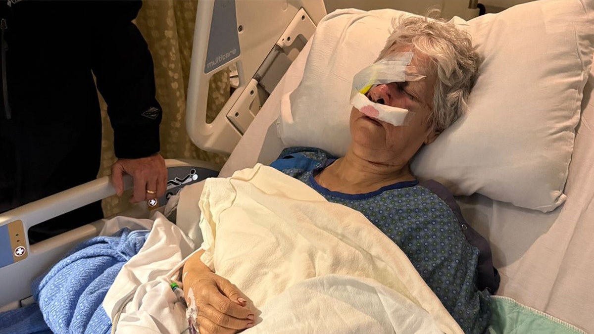 Jeanette Marken in hospital bed with eye bandaged