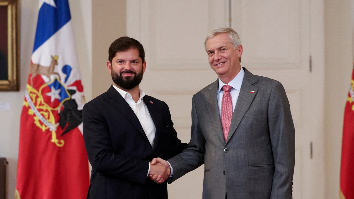 Chile's President Gabriel Boric and President-elect Jose Antonio Kast meet at La Moneda Presidential Palace after Kast won in the runoff presidential election, in Santiago, Chile December 15, 2025.