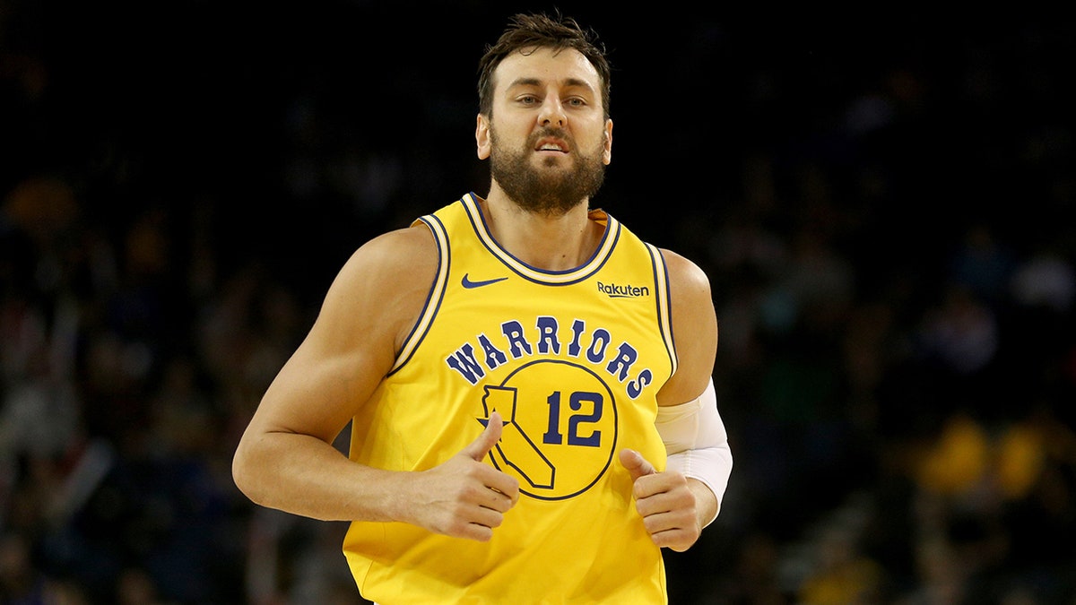 Andrew Bogut runs down the court