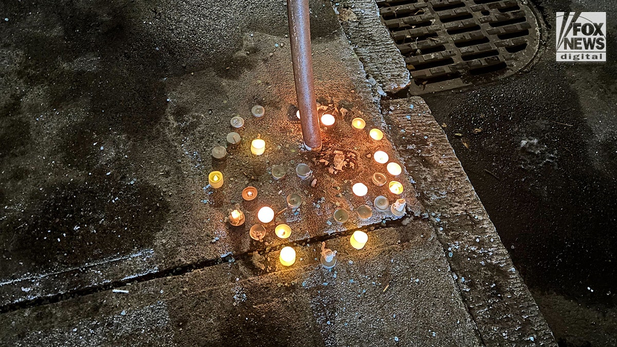 Candles left in memory of MIT professor Numo Louriero